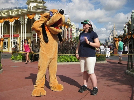 Pluto signing the autograph book.